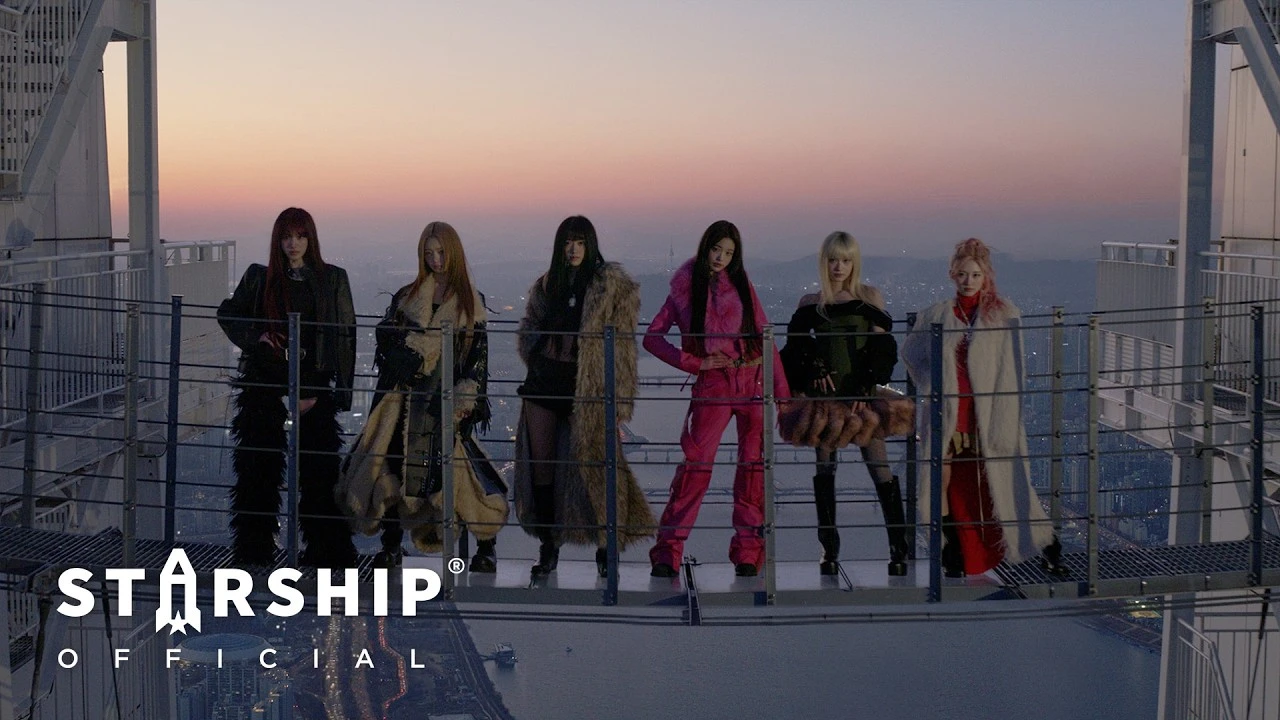 IVE BLACKHOLE music video scene with all six members on a rooftop at sunset