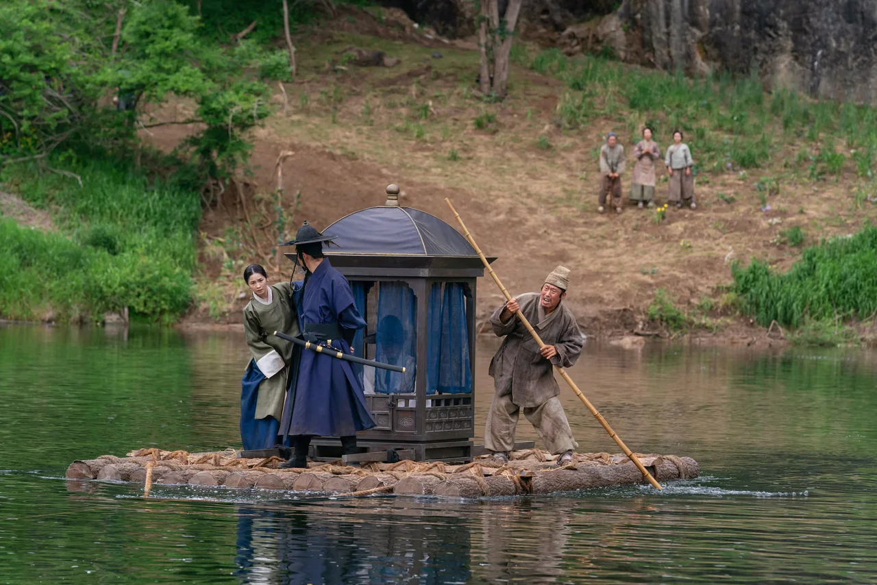 River crossing scene from The King's Warden with Joseon-era characters on a raft