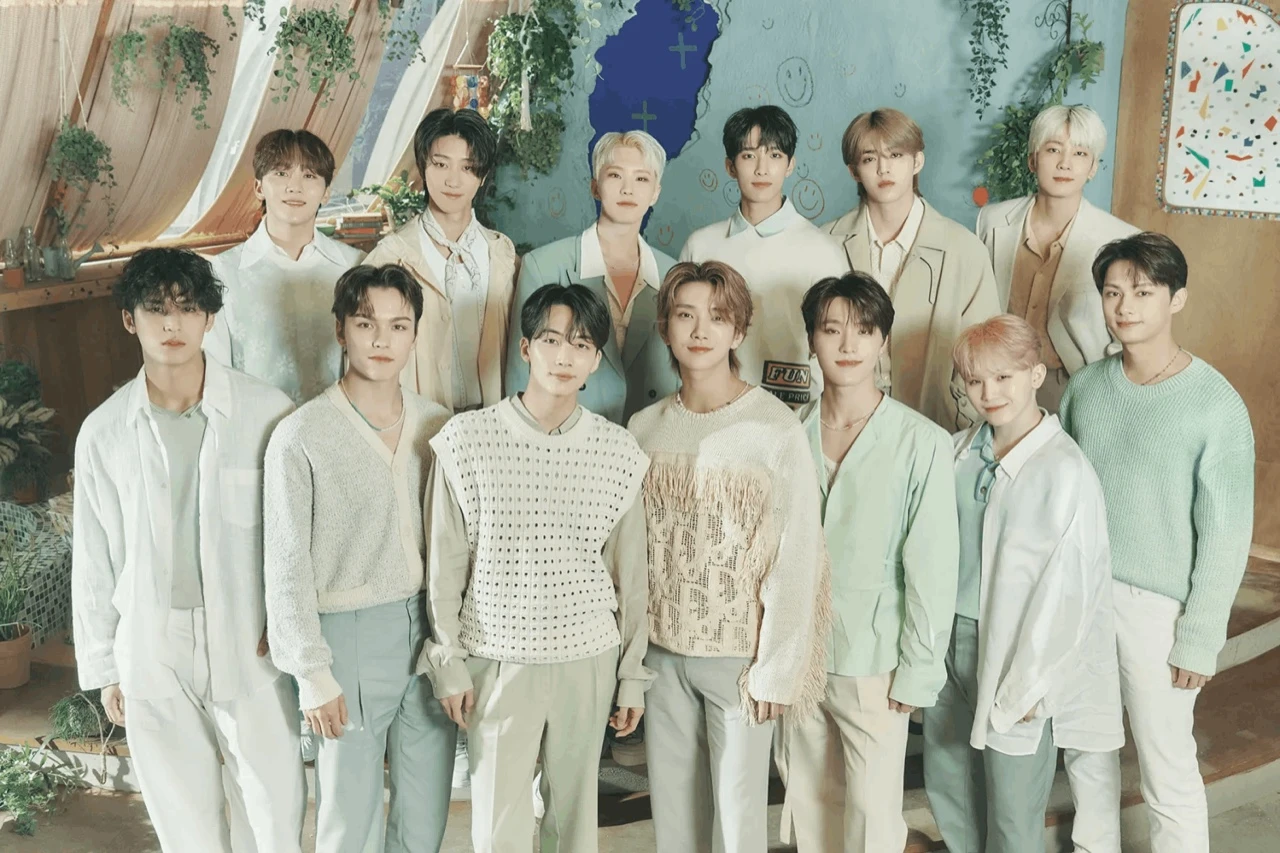 SEVENTEEN group photo, all thirteen members in coordinated pastel outfits