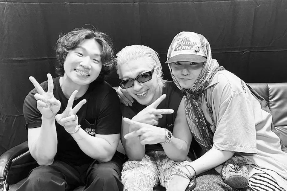 BIGBANG members G-Dragon, Taeyang, and Daesung posing together