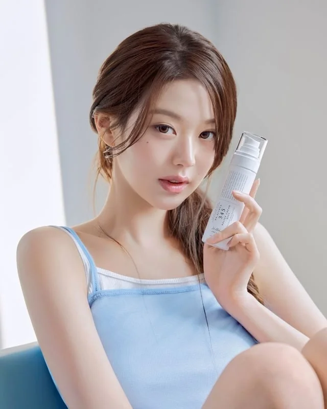 Jang Wonyoung holding multiple Dr. Althea 345 products in a lifestyle campaign setting