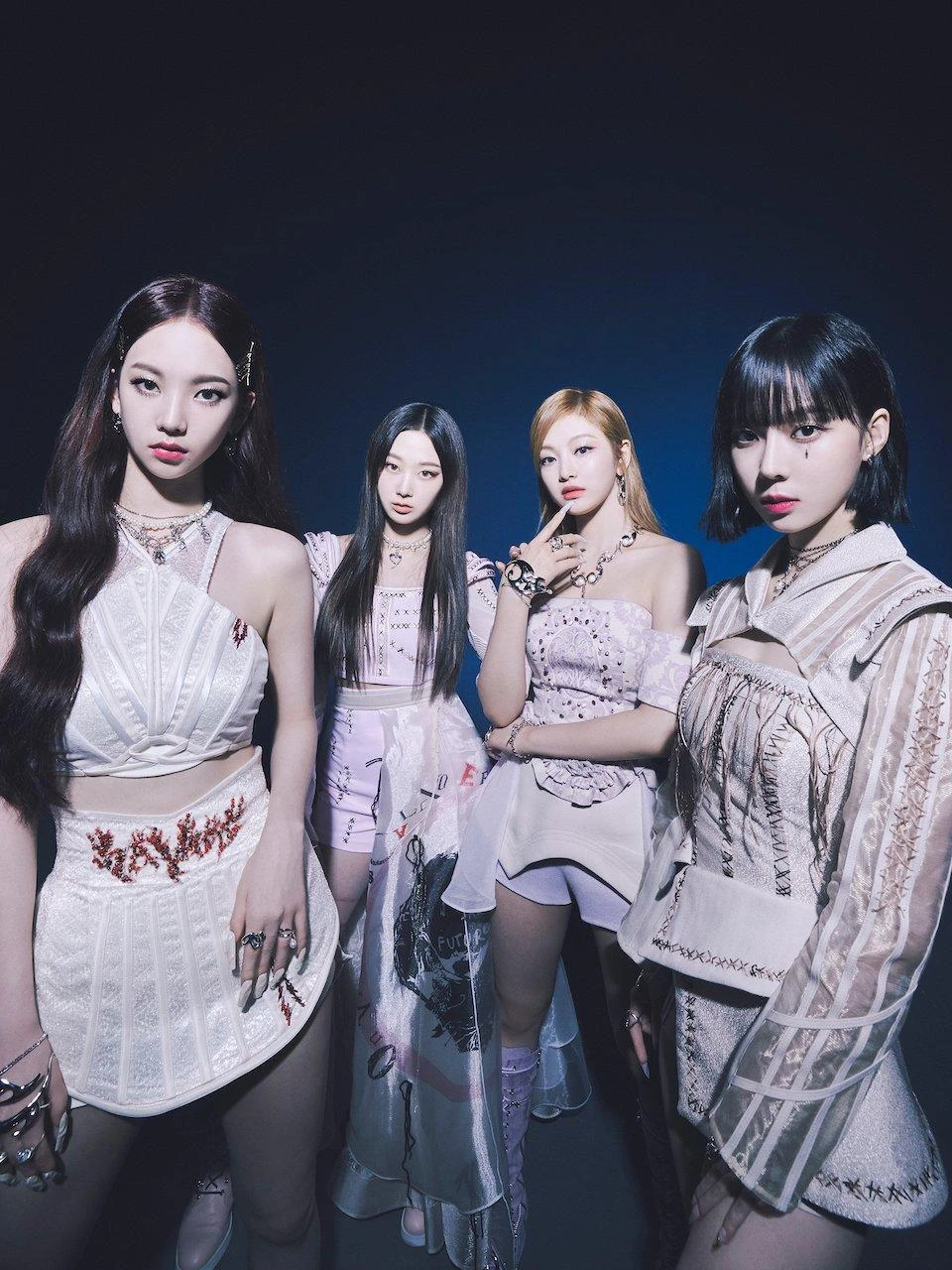 aespa promotional photo featuring all four members in white coordinated outfits
