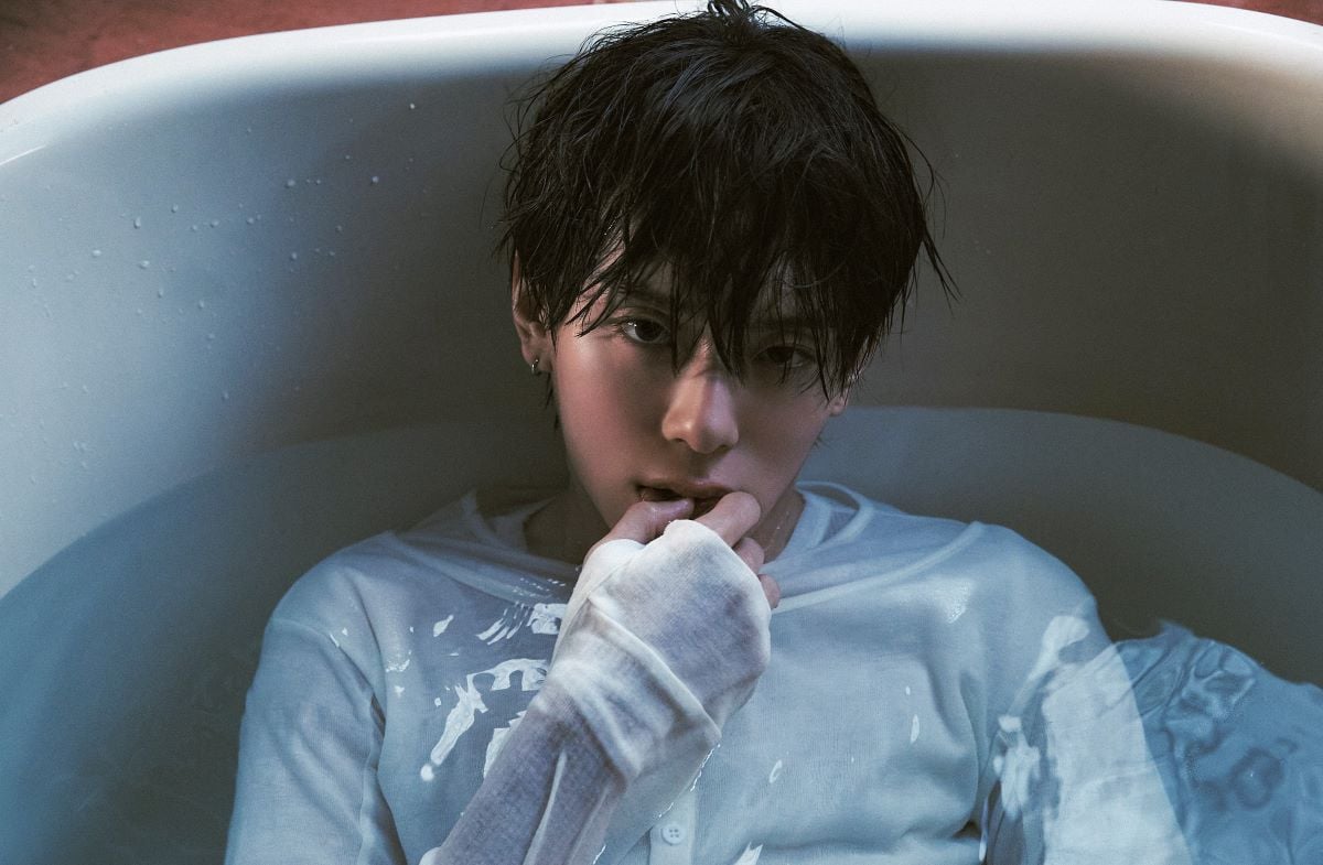 Kangmin Free Falling concept photo showing the artist in a bathtub, moody cinematic style