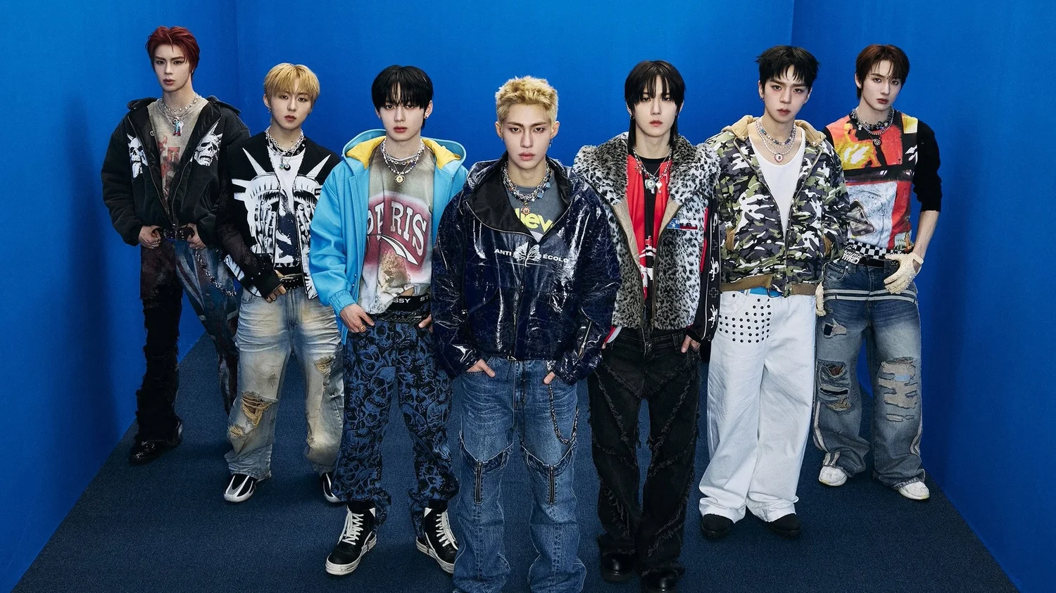 NOUERA members celebrating in the official POP IT LIKE music video with money raining down