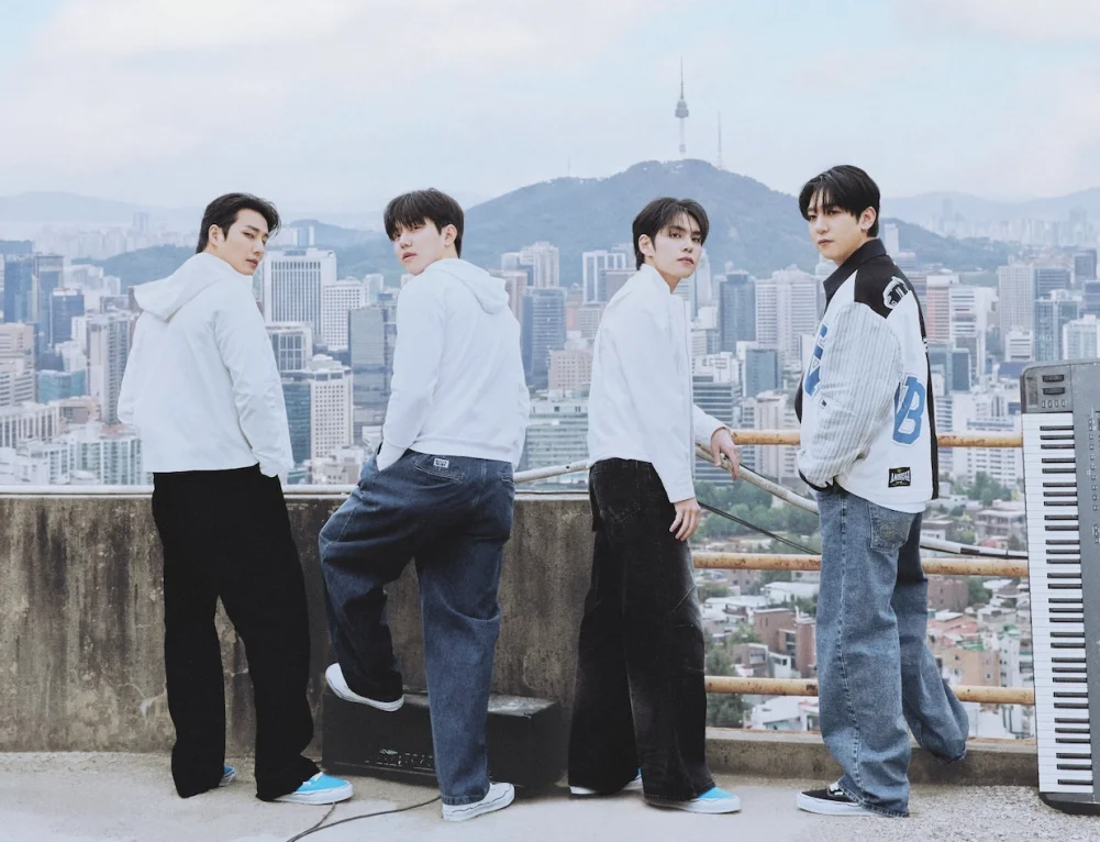 DAY6 members posing with Seoul skyline backdrop for the Umbro Seoul Collection 2026 campaign