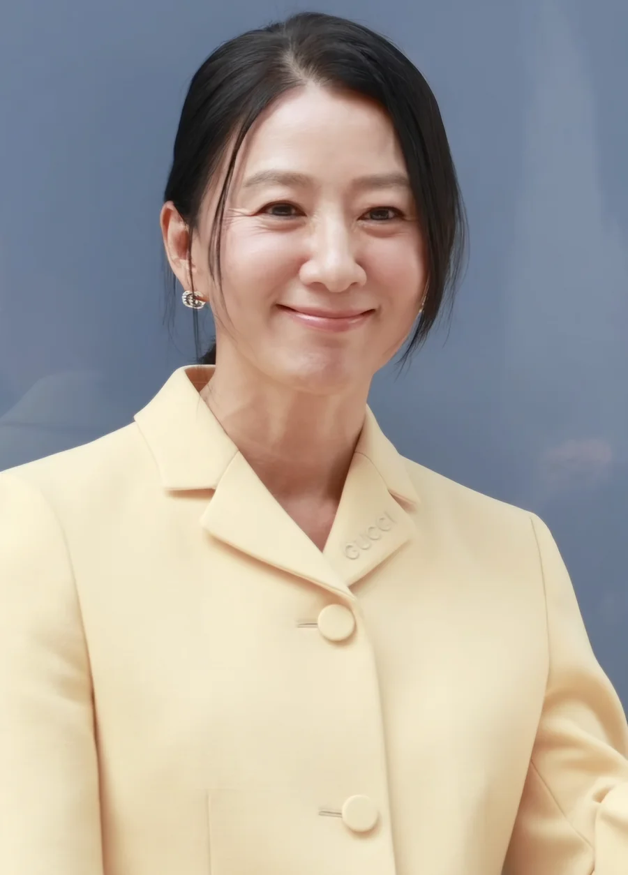 Kim Hee-ae at a public event in September 2024, photographed in a white collared shirt and cream knit sweater