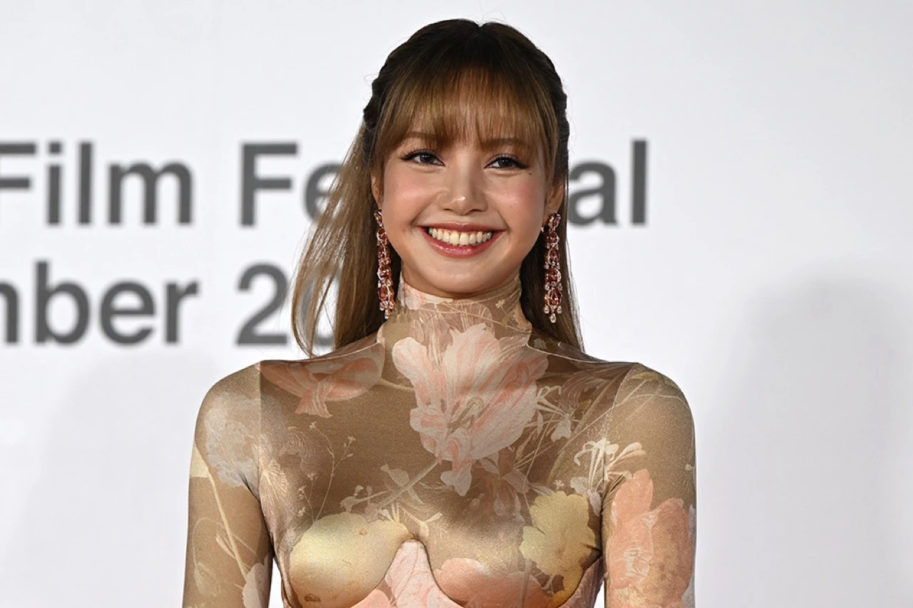 Lisa at a promotional event, styled in editorial fashion