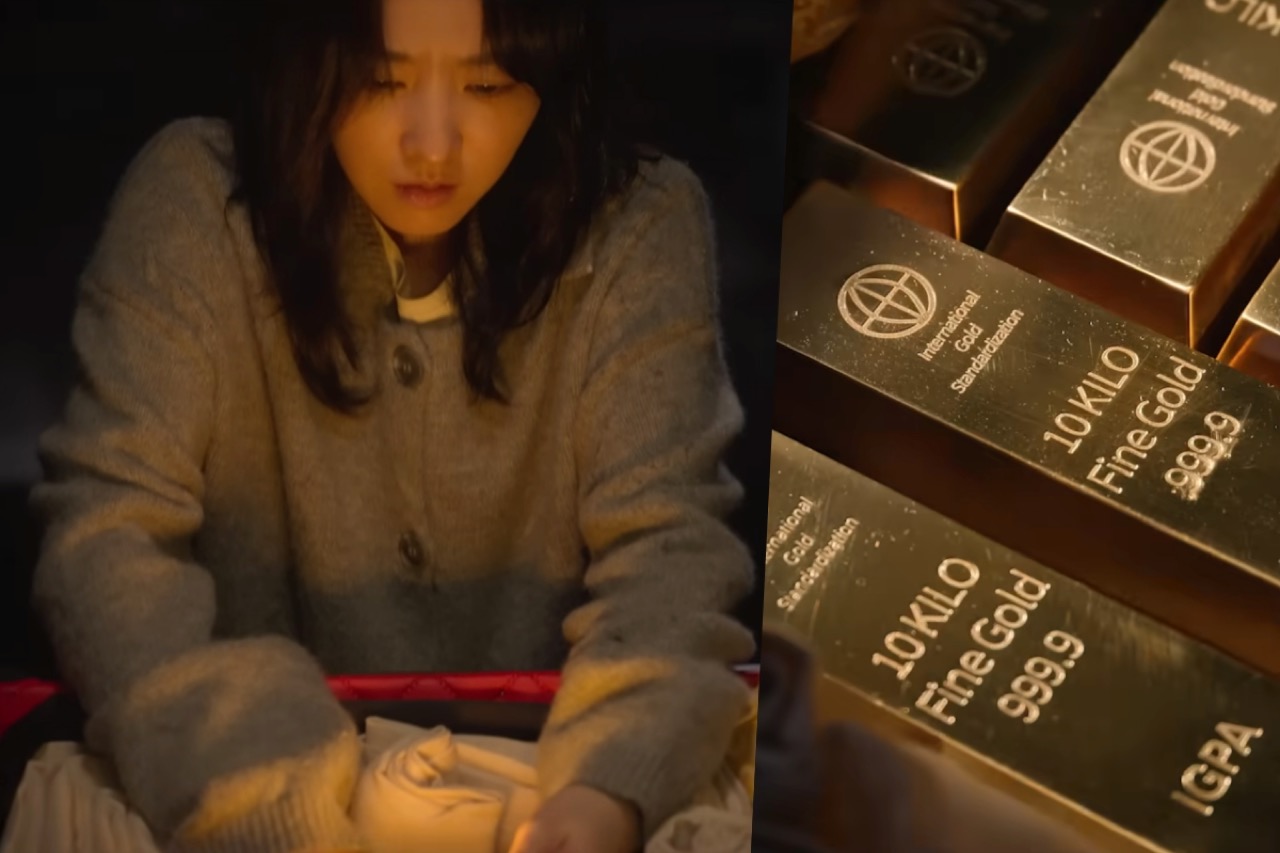Park Bo-young as Kim Hee-ju examining gold bars in a still from Gold Land