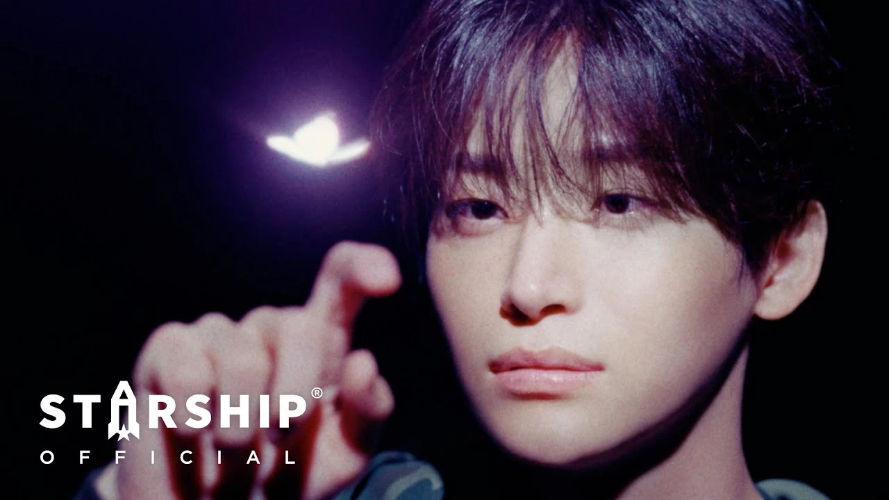 A moody still from an official CRAVITY performance video