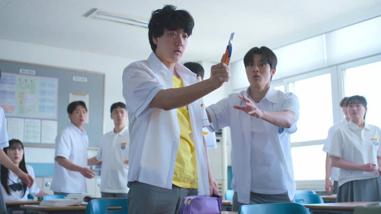 A tense classroom scene from Netflix's If Wishes Could Kill showing students facing off as the curse linked to the Girigo app escalates.