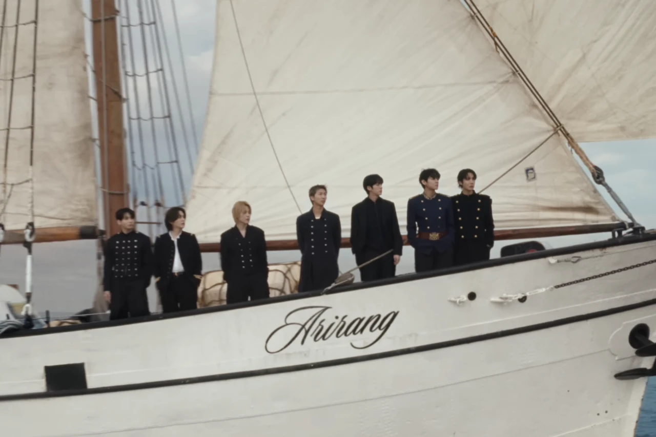 BTS standing together aboard the ship Arirang in the SWIM music video