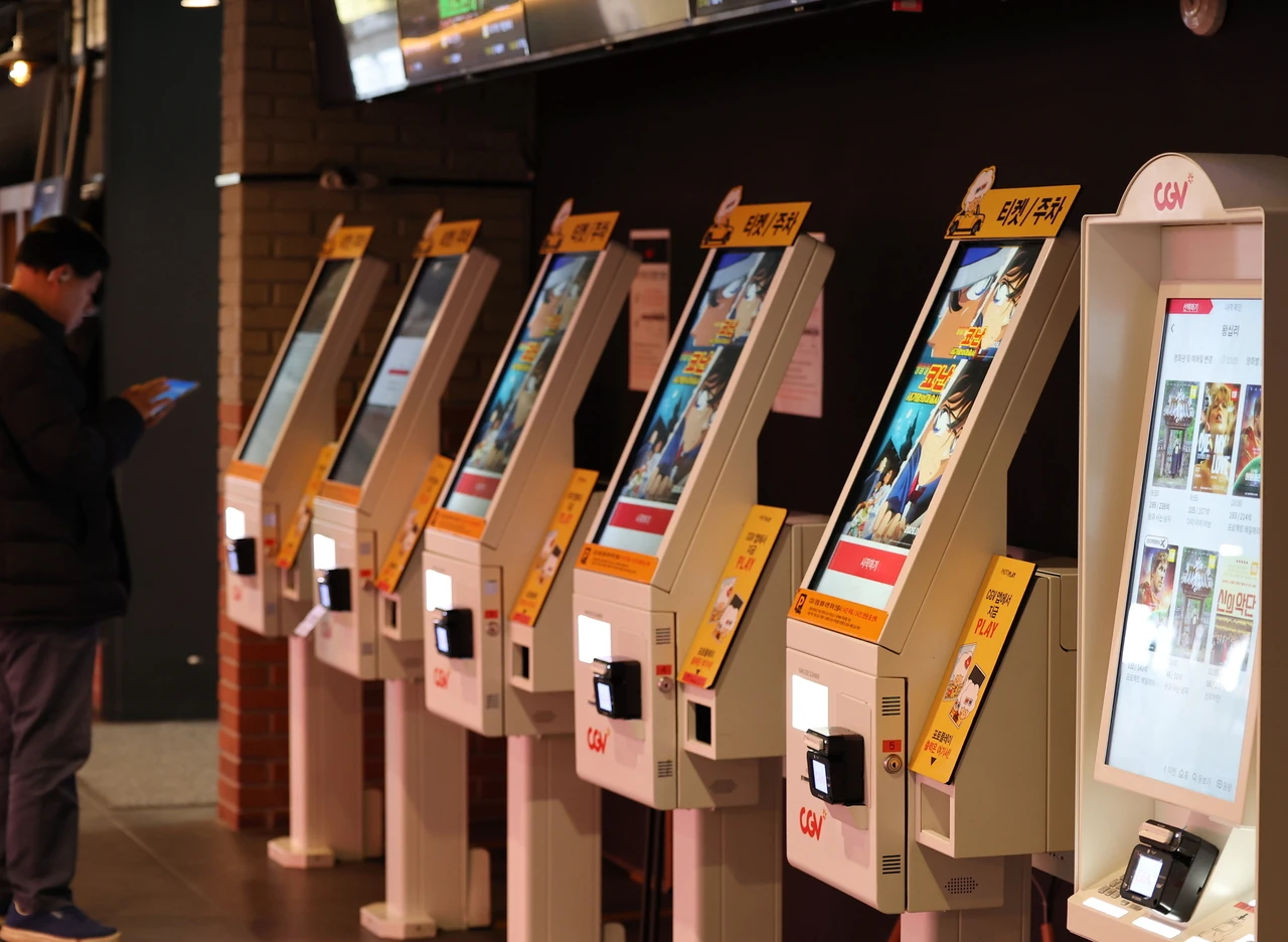 CGV self-service ticket kiosks inside a South Korean multiplex cinema