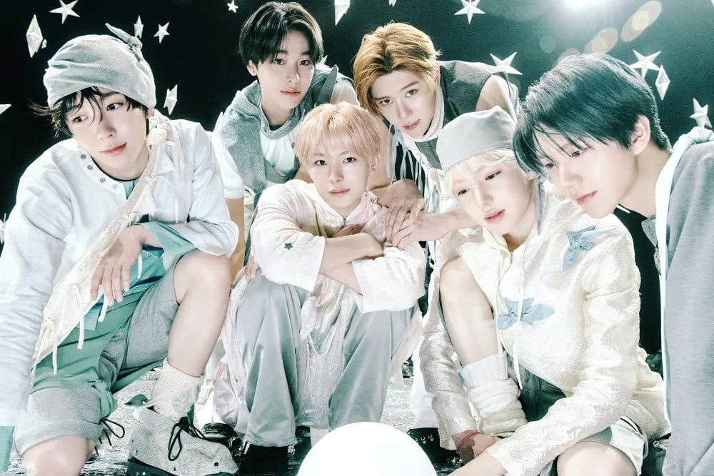 NCT WISH members pose in a softly lit white set for Ode To Love concept imagery