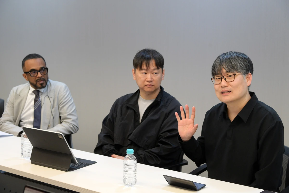 Chris Turner, Joo Dong geun, and Suh Beom geun speak at a Seoul press conference about changes in Korea's webtoon industry