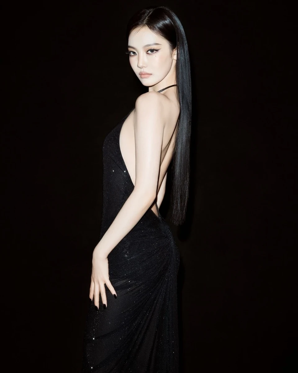 Ningning posing in a black backless dress in one of Gucci's release portraits