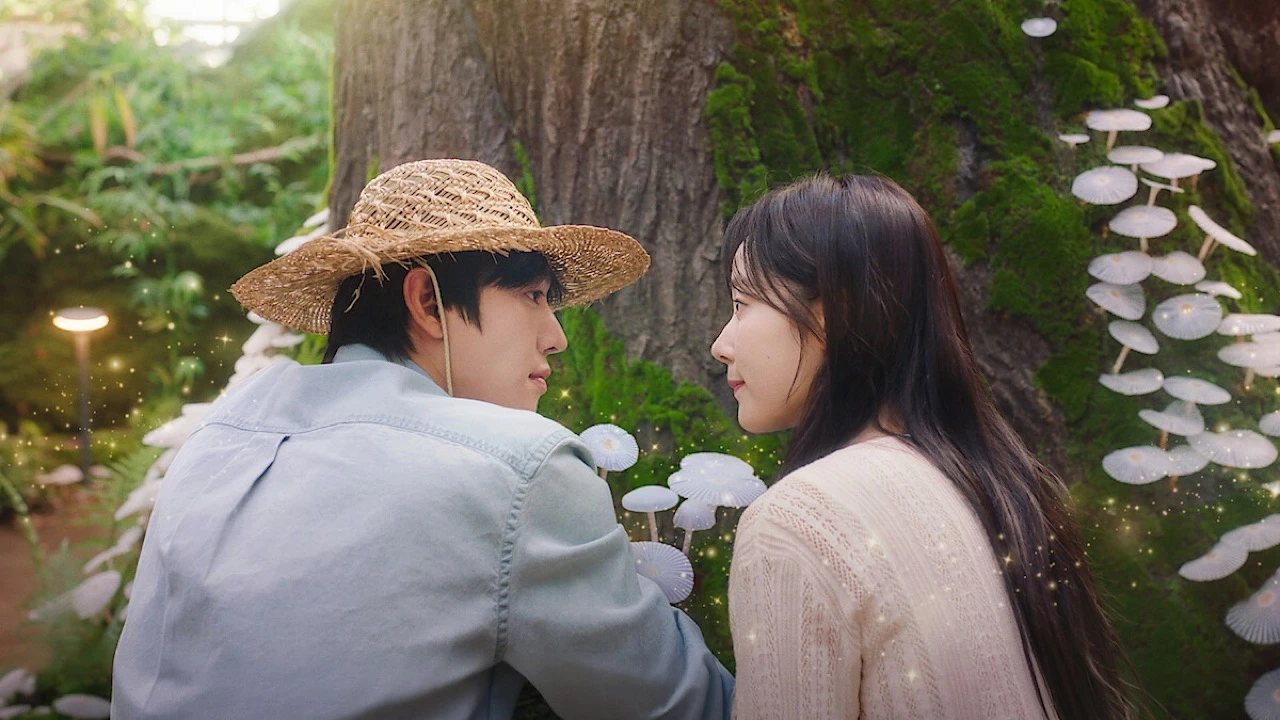 Ahn Hyo-seop and Chae Won-bin sit together beside a mossy tree in a scene from Sold Out on You