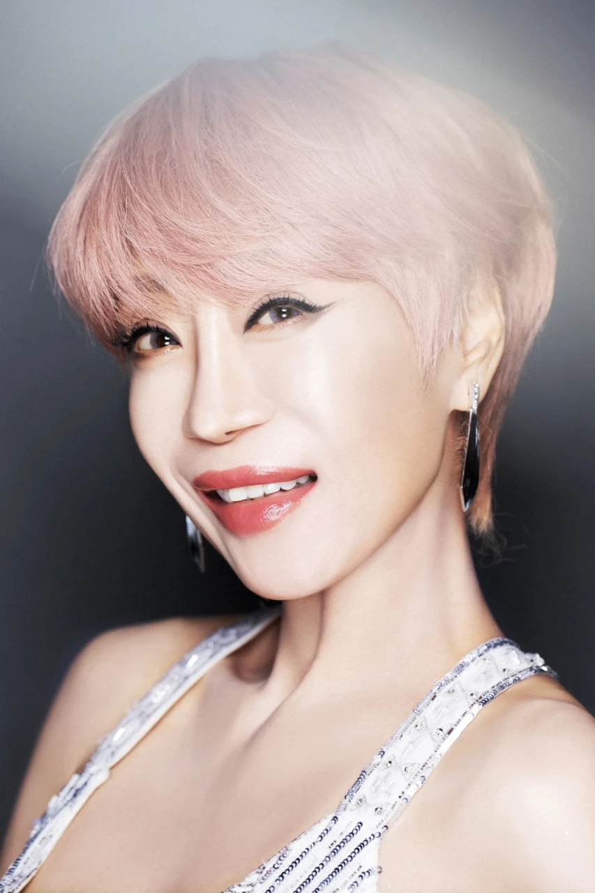Sumi Jo smiling in a studio portrait released for her 40th anniversary concert promotions