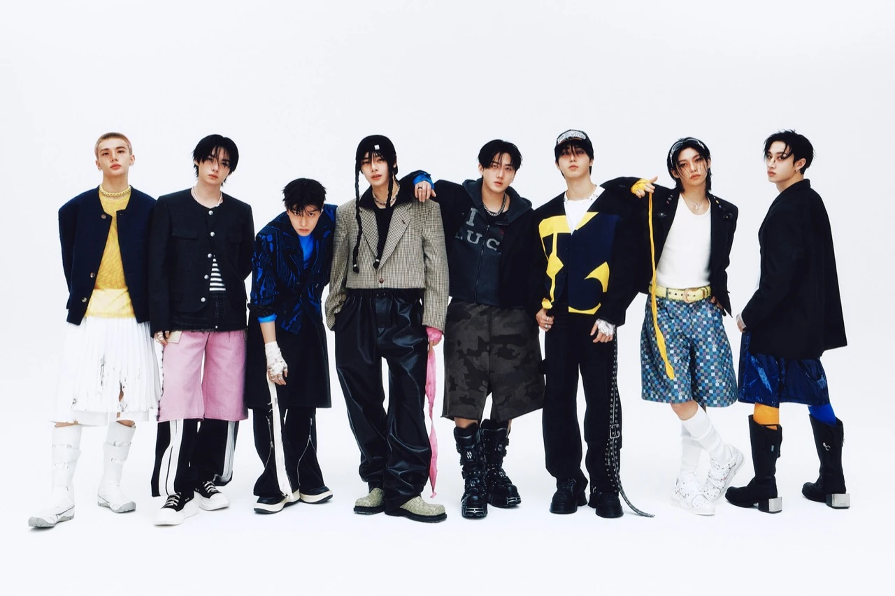 Stray Kids pose in a studio group photo in editorial styling