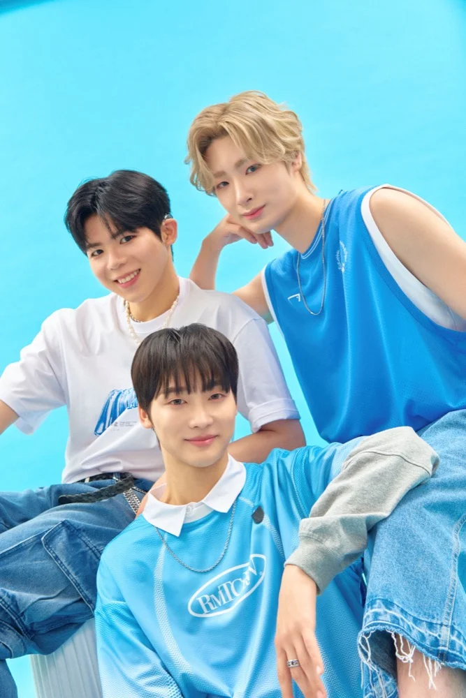 Big Ocean members posing in official promotional photography against a bright blue backdrop