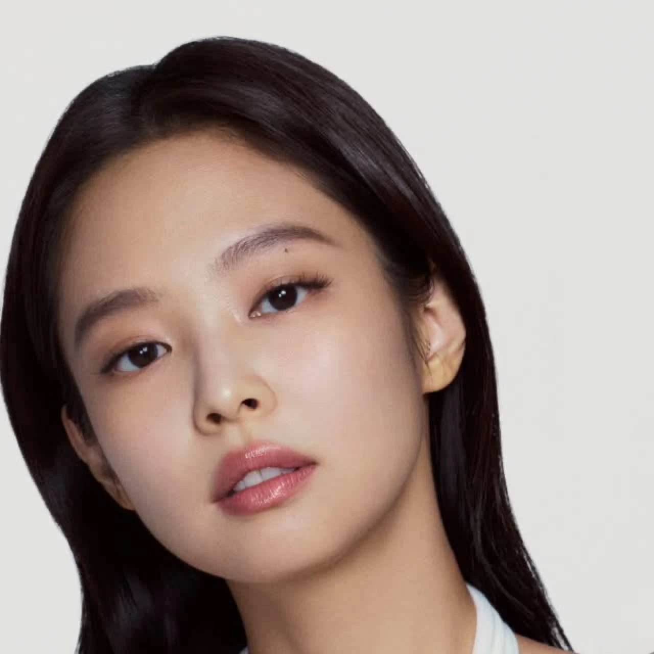 Jennie in a close-up campaign image for Vaseline body care